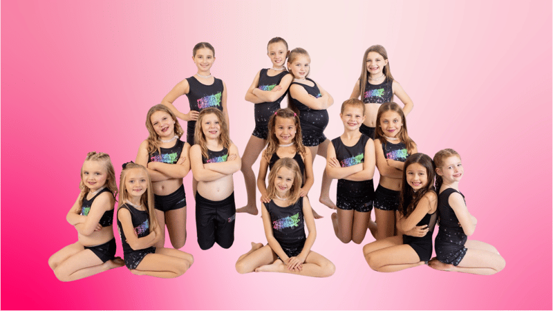 team of kids in dance outfits on pink and white background